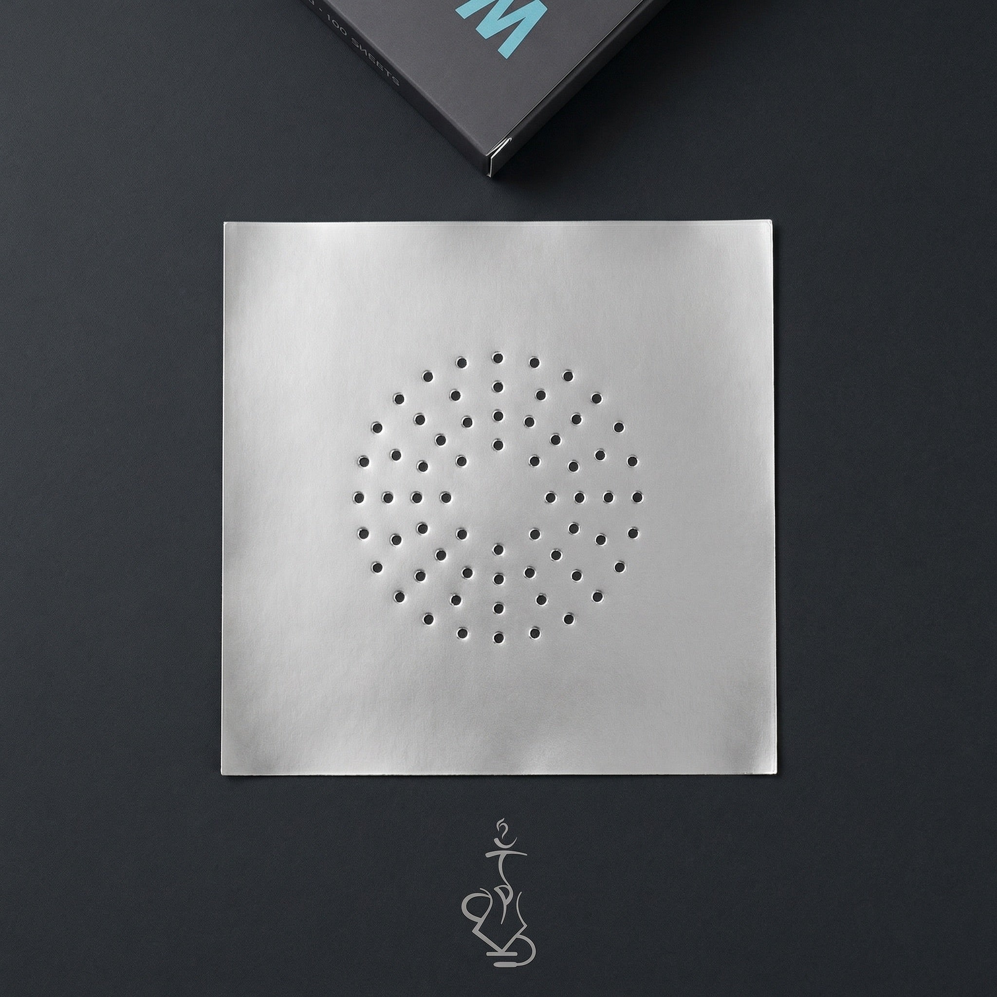 Wolverine 42-micron pre-poked hookah foil sheet showing scattered hole pattern on dark surface with Thicc Foil dispenser box
