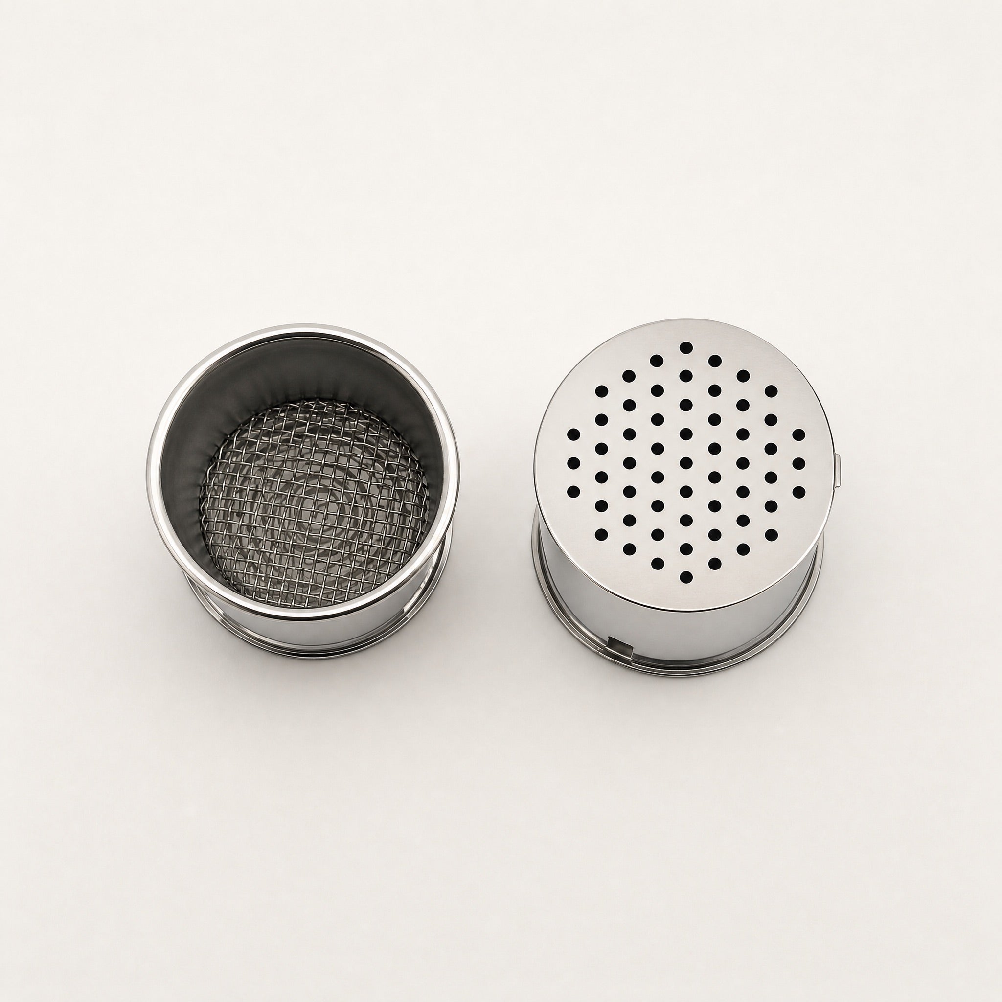 XKAH Pro shisha pod shown open with stainless mesh interior beside a closed pod with perforated lid in place.