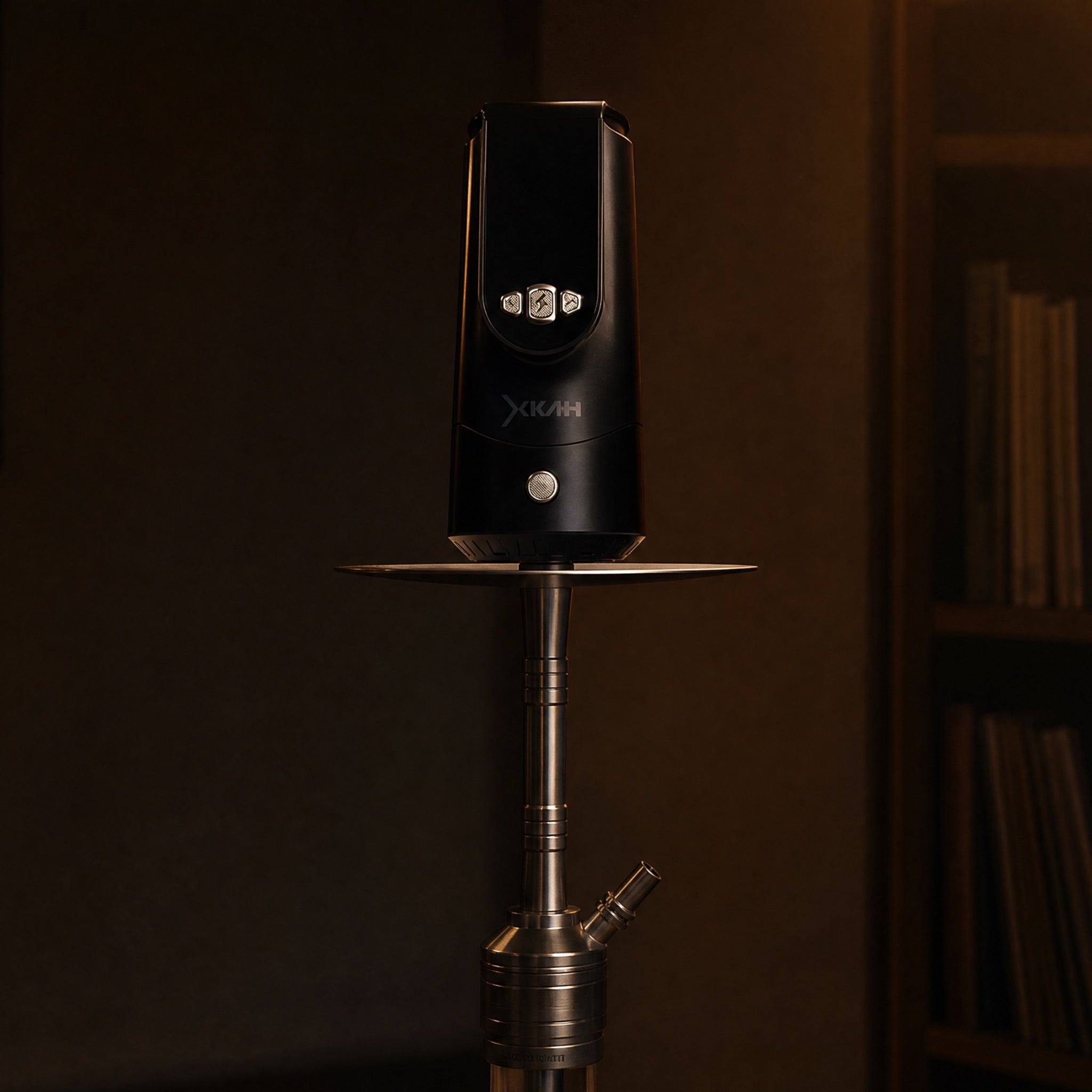 XKAH Pro electronic heat device seated on a modern stainless hookah stem, confirming contemporary shisha compatibility.