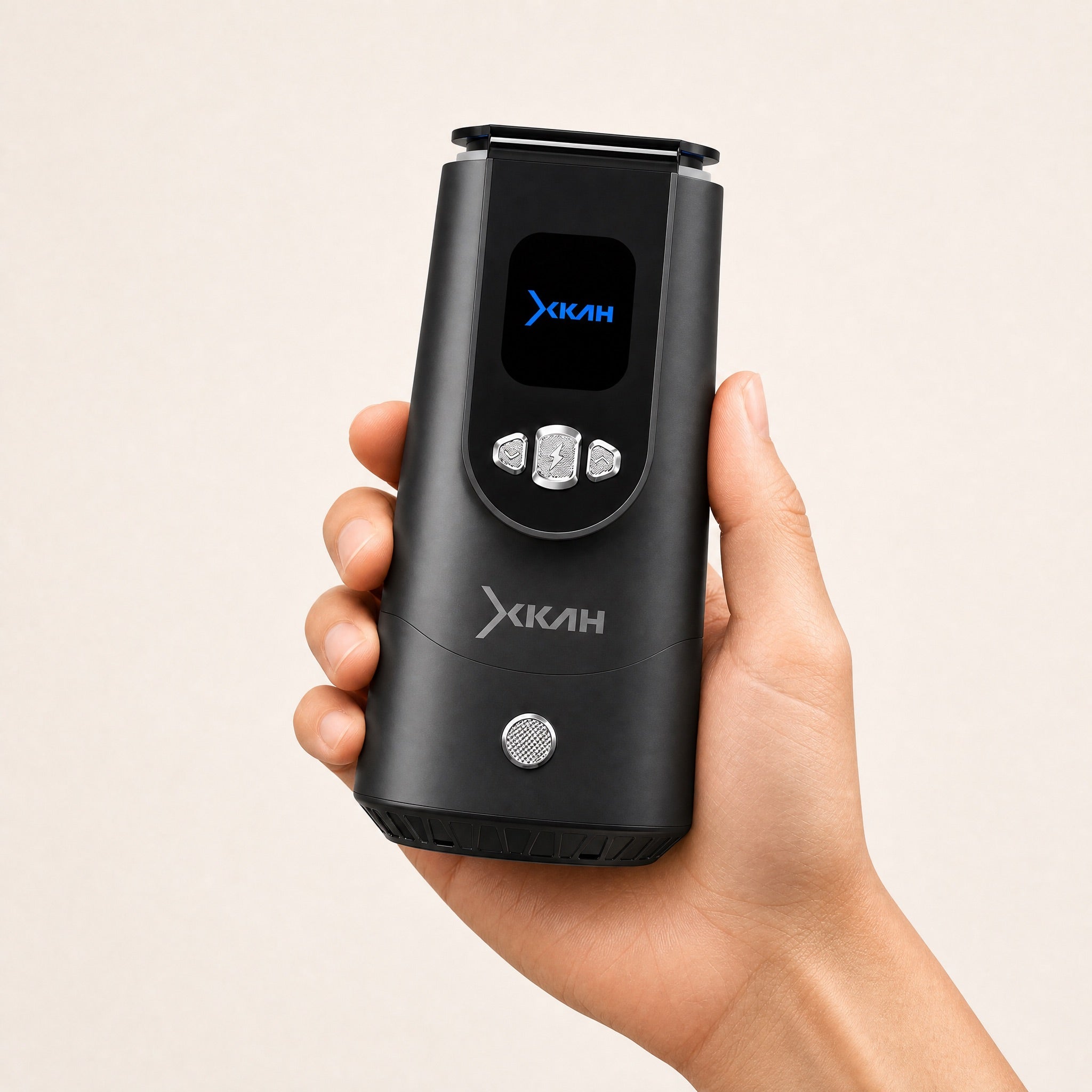 Hand holding the XKAH Pro electronic heat management device, showing its portable size and natural grip.